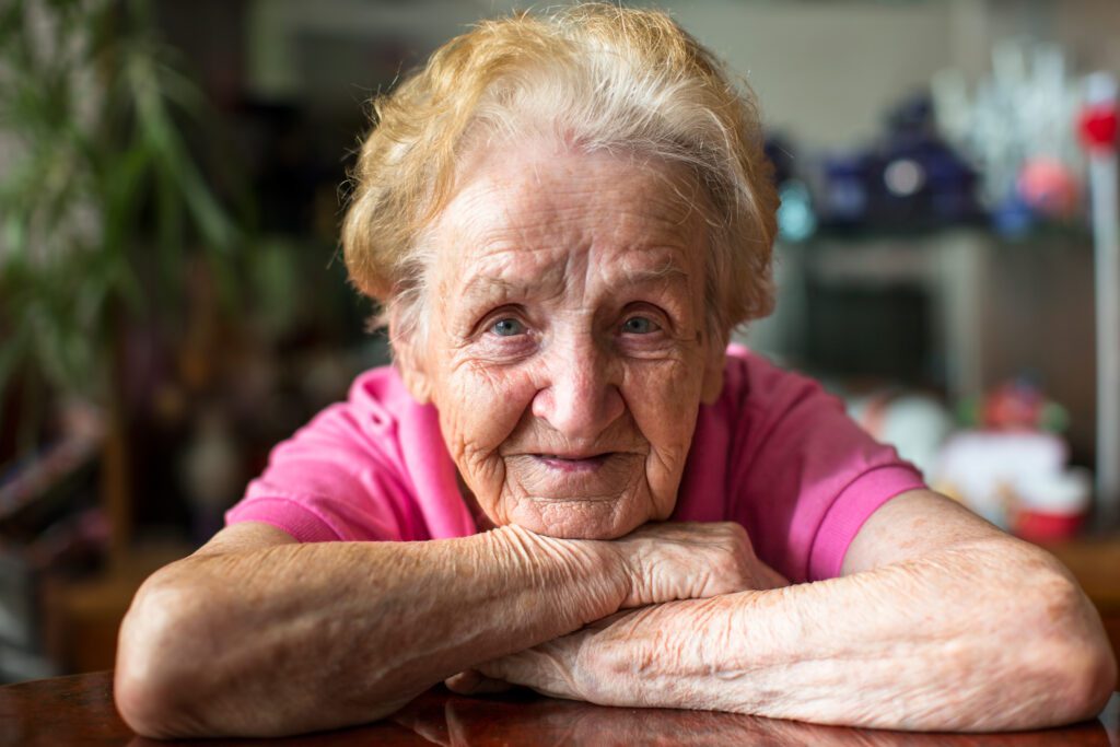 Closeup portrait of happy elderly woman.